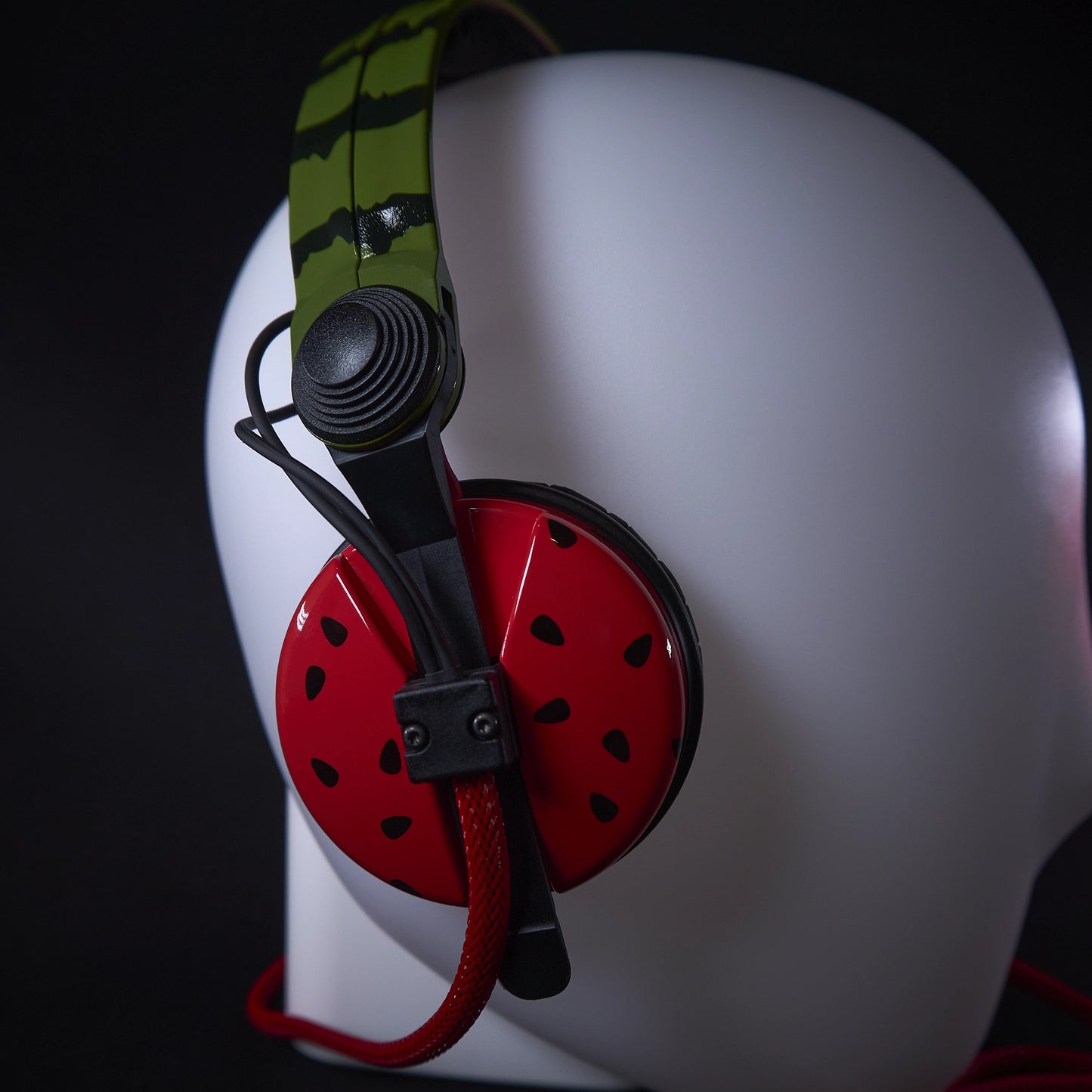 Custom Sennheiser HD25 headphones with unique watermelon-themed hand-painted design, red earcups, green headband, and red audio cable.
