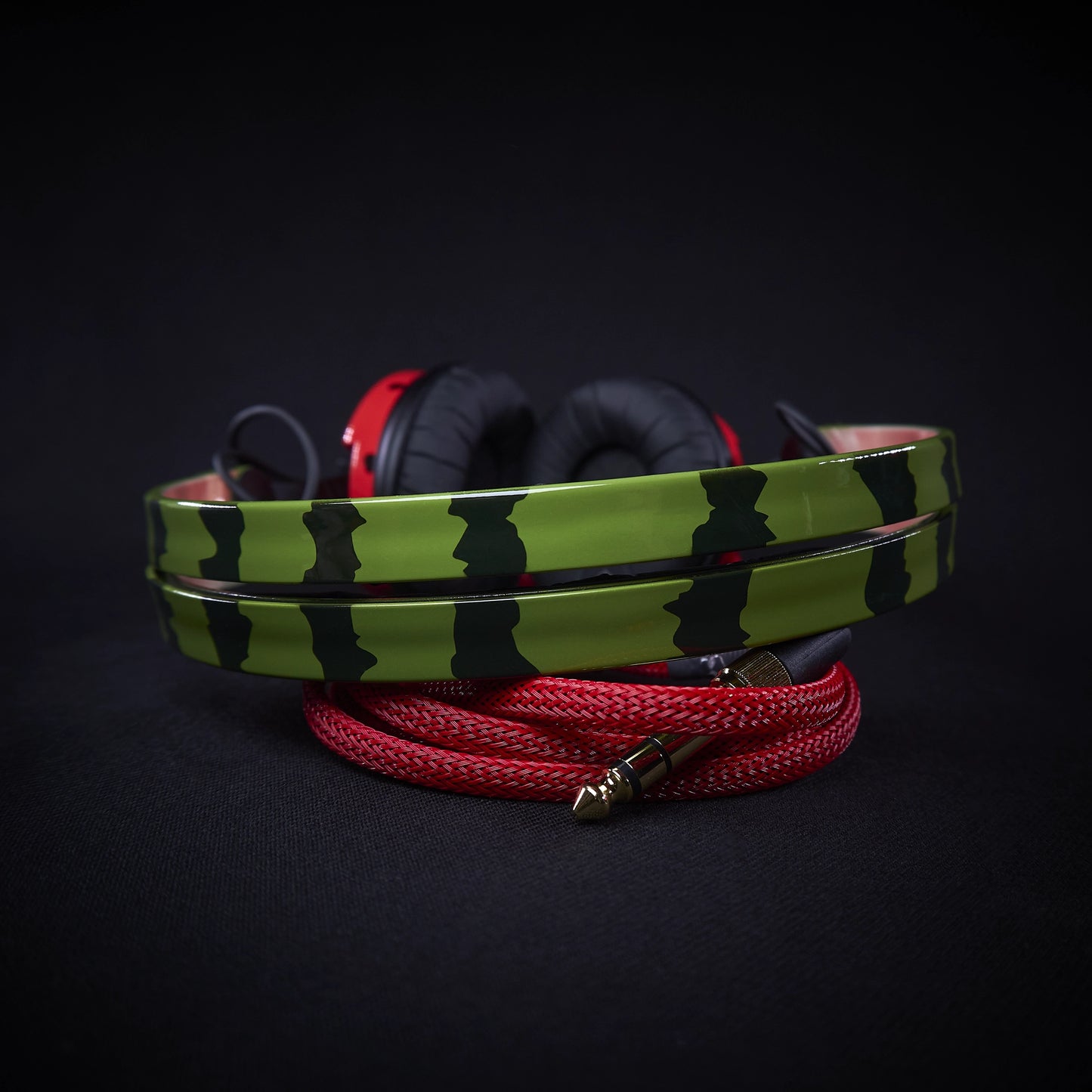 Custom Sennheiser HD25 headphones with unique watermelon-themed hand-painted design, red earcups, green headband, and red audio cable.
