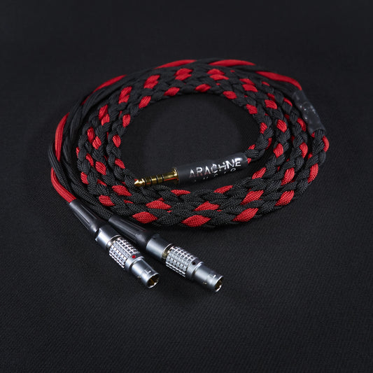 Braided audio cable with black and red pattern on a dark background
