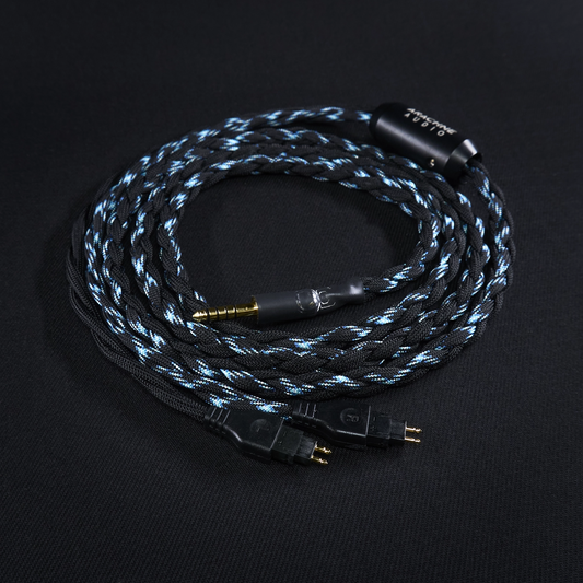 Braided audio cable with gold connectors on a black background
