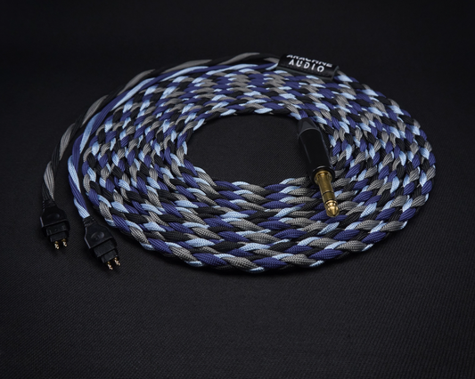 Braided audio cable with gold connectors on a black background