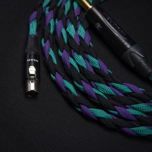 Braided audio cable with XLR connectors on a black background