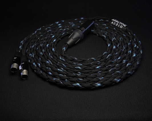 Coiled audio cable with braided design on a black background