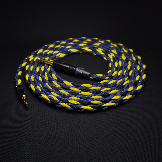 Braided blue and yellow audio cable on a black background