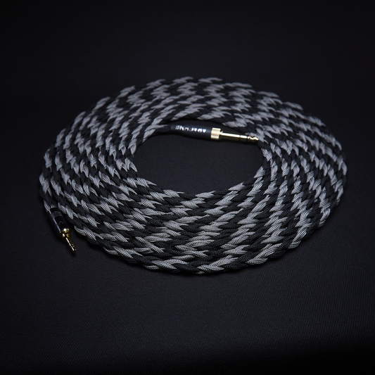 Coiled audio cable with braided design on a black background