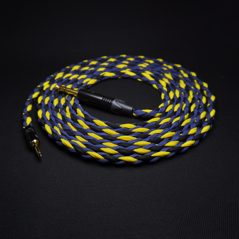 Braided blue and yellow audio cable on a black background