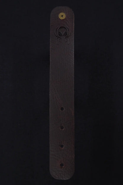Fermata leather cable strap in Tobacco (tobacco brown) with brass stud and embossed Arachne spider